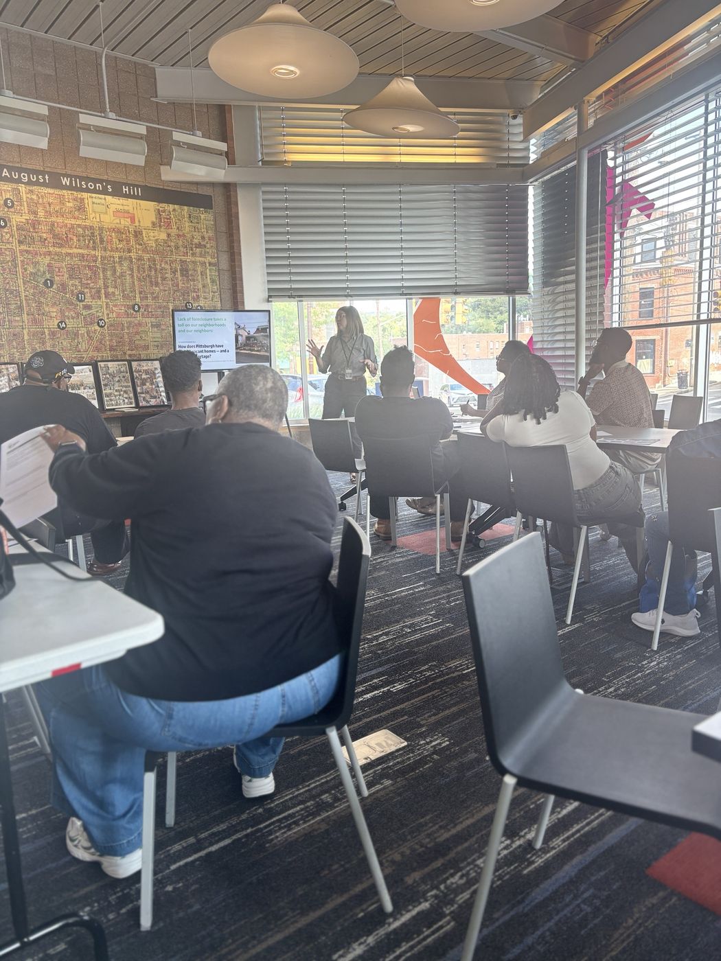 Residents attend a housing presentation